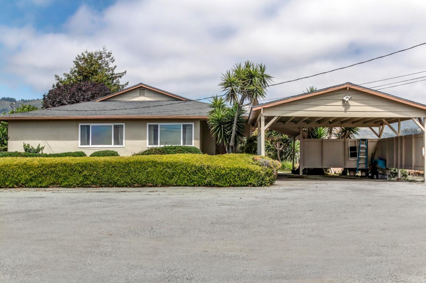 85 Kerr Road Watsonville, CA 95076 - Photo 1 of 29 a view of a house with a yard and potted plants