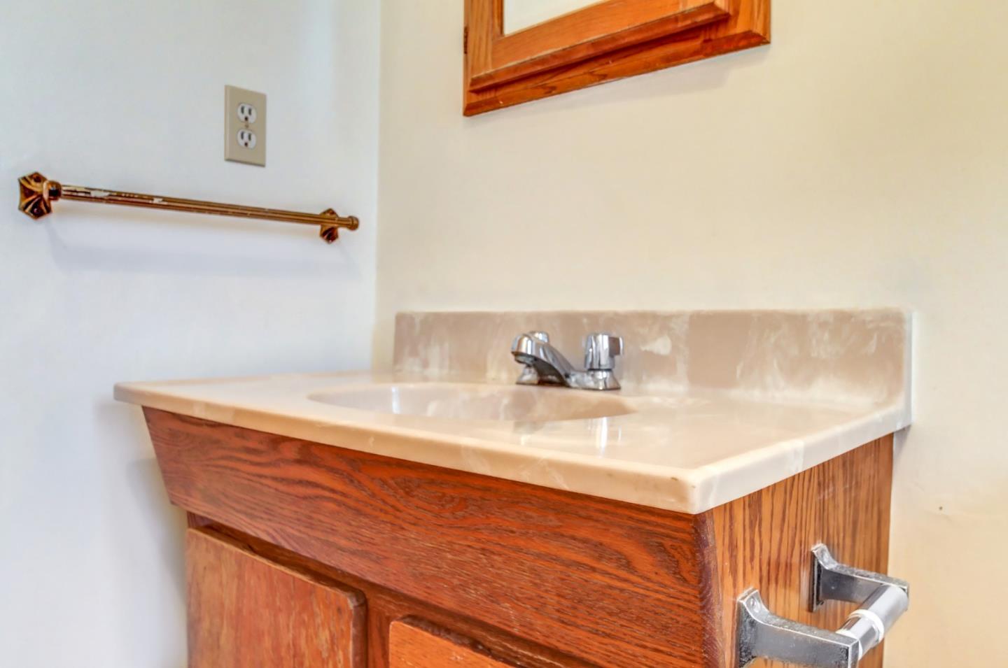 85 Kerr Road Watsonville, CA 95076 - Photo 12 of 29 a bathroom with a sink and a mirror