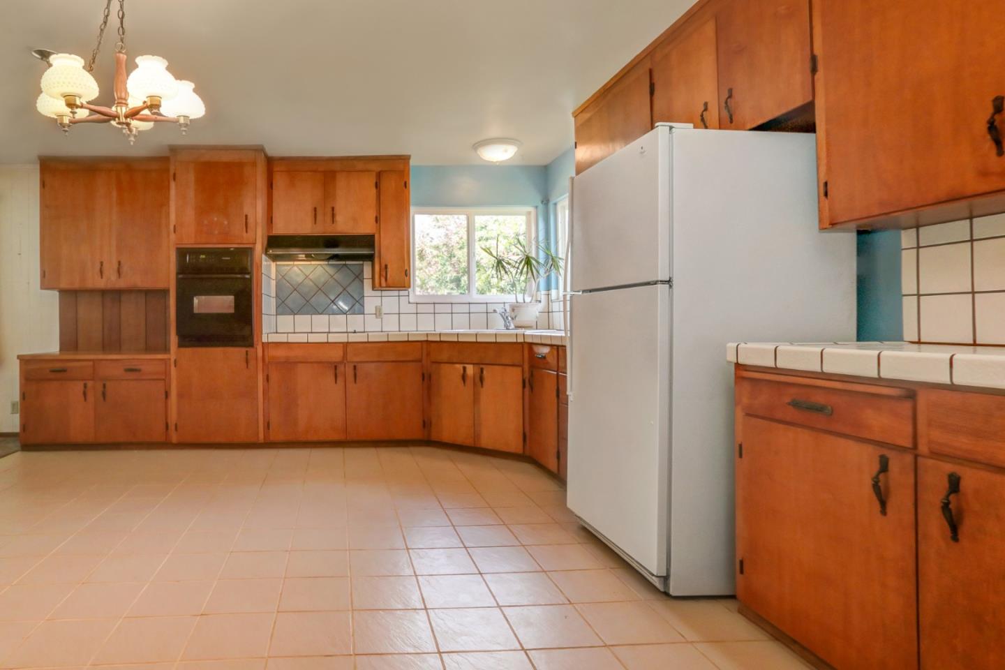 85 Kerr Road Watsonville, CA 95076 - Photo 3 of 29 a kitchen with stainless steel appliances granite countertop a refrigerator a oven and a sink