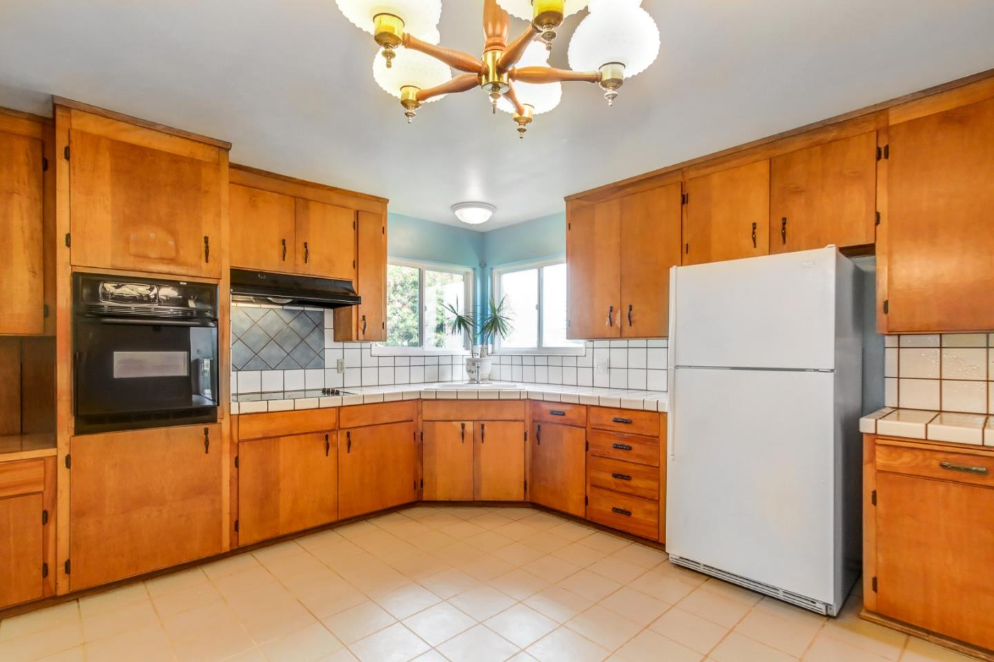 85 Kerr Road Watsonville, CA 95076 - Photo 7 of 29 a kitchen with stainless steel appliances granite countertop a refrigerator a sink and dishwasher