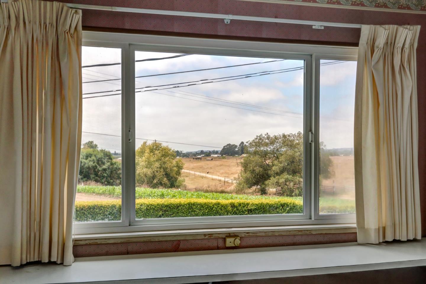 85 Kerr Road Watsonville, CA 95076 - Photo 8 of 29 a view of a room that has a large window and front door