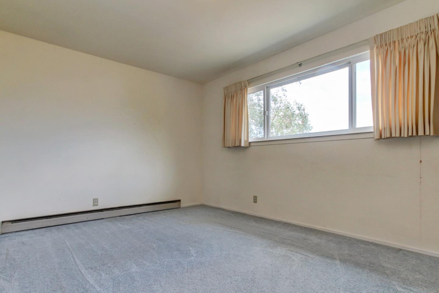 85 Kerr Road Watsonville, CA 95076 - Photo 10 of 29 an empty room with windows