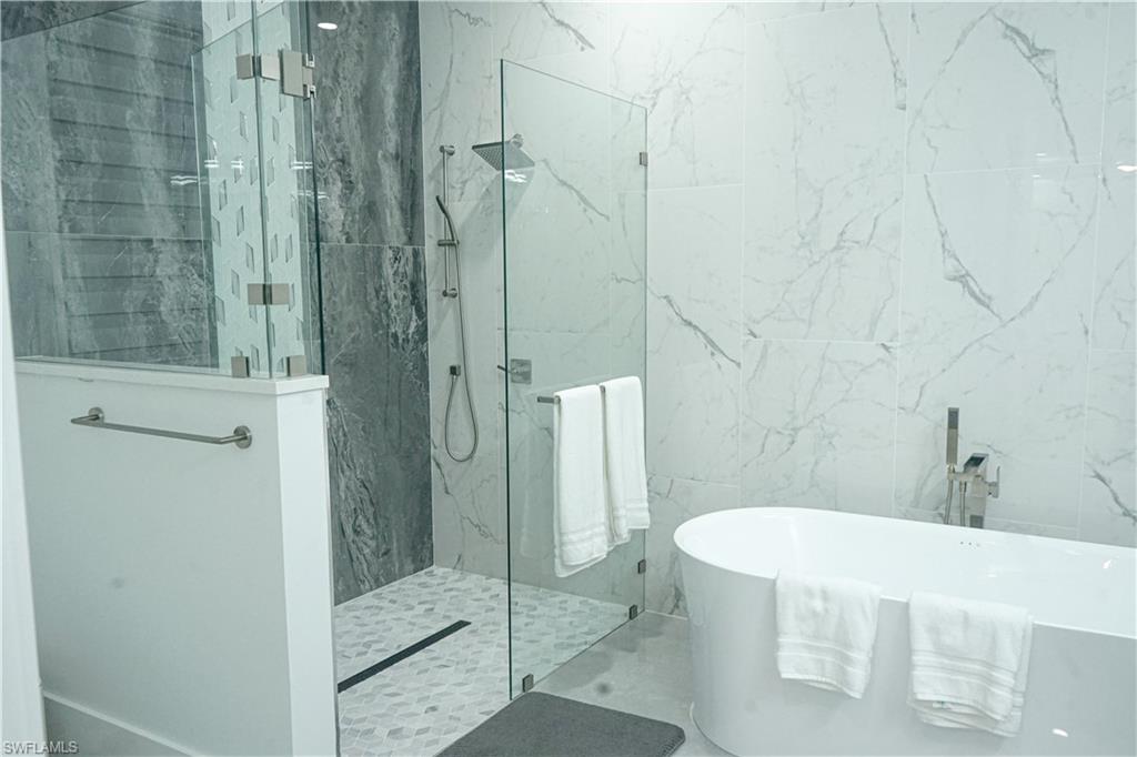 Undisclosed Address Naples, FL 34117 - Photo 11 of 23 a bathroom with a shower and a toilet