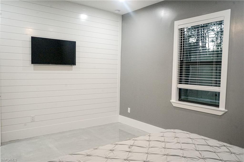 Undisclosed Address Naples, FL 34117 - Photo 22 of 23 a view of a livingroom with an empty space & microwave
