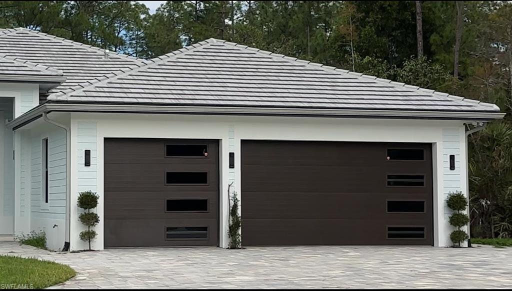 Undisclosed Address Naples, FL 34117 - Photo 3 of 23 a front view of a house