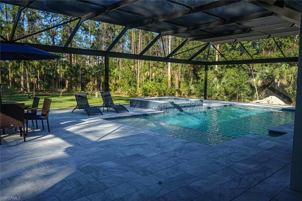Undisclosed Address Naples, FL 34117 - Photo 4 of 23 a view of outdoor space with seating