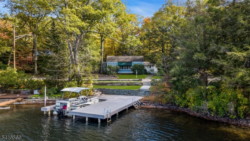 149 Lake End Road Newfoundland, NJ 07435 - Photo 1 of 49 a view of house with backyard space and swimming pool