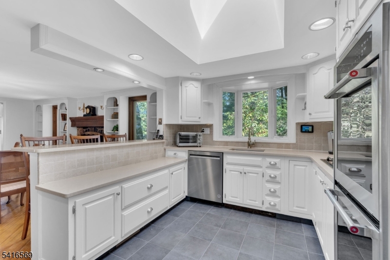 149 Lake End Road Newfoundland, NJ 07435 - Photo 15 of 49 a spacious kitchen with stainless steel appliances granite countertop a stove and a sink