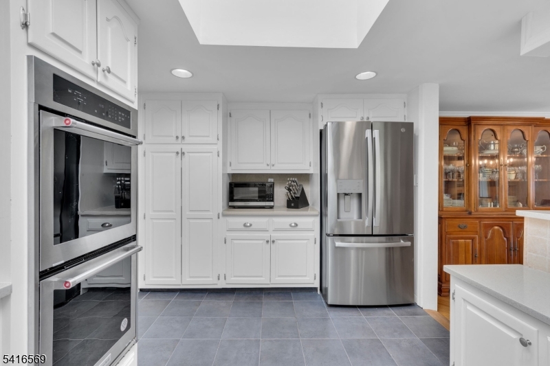 149 Lake End Road Newfoundland, NJ 07435 - Photo 16 of 49 a kitchen with stainless steel appliances a refrigerator and a stove top oven