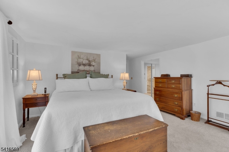 149 Lake End Road Newfoundland, NJ 07435 - Photo 20 of 49 a bedroom with a bed and dresser