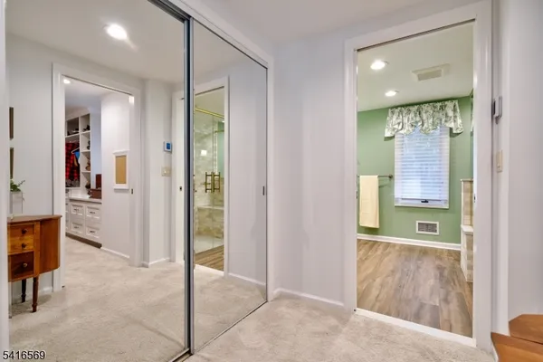 a bathroom with a glass door shower