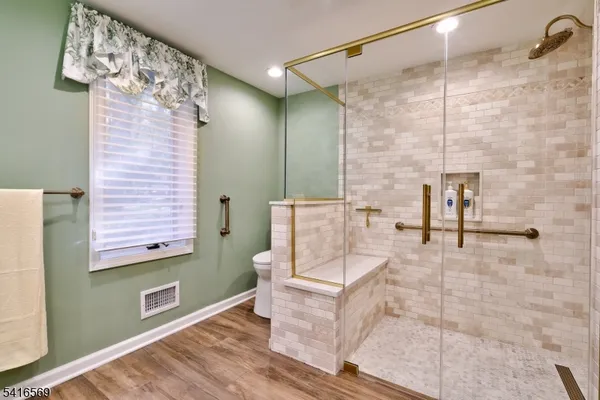 a bathroom with a bathtub and shower