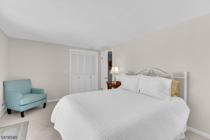 149 Lake End Road Newfoundland, NJ 07435 - Photo 26 of 49 a bedroom with a bed and a couch