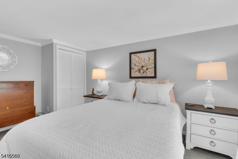 149 Lake End Road Newfoundland, NJ 07435 - Photo 27 of 49 a bedroom with a bed and a night stand
