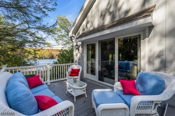 a view of balcony with couch and chairs
