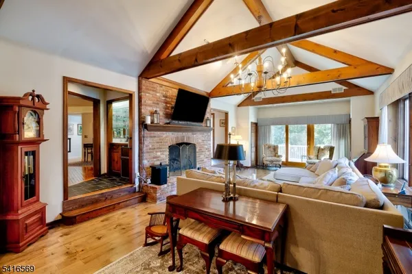 a view of a livingroom with furniture and a fireplace