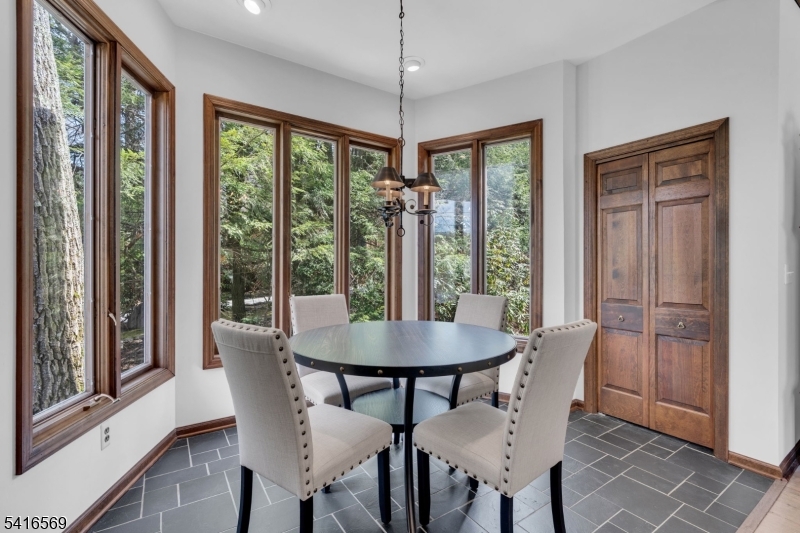 149 Lake End Road Newfoundland, NJ 07435 - Photo 8 of 49 a view of a dining room with furniture window and outside view