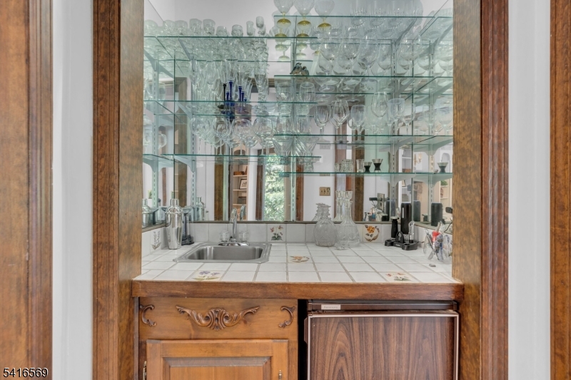 149 Lake End Road Newfoundland, NJ 07435 - Photo 9 of 49 a bathroom with a granite countertop sink a mirror and shower