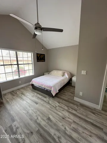 a bedroom with a bed and window