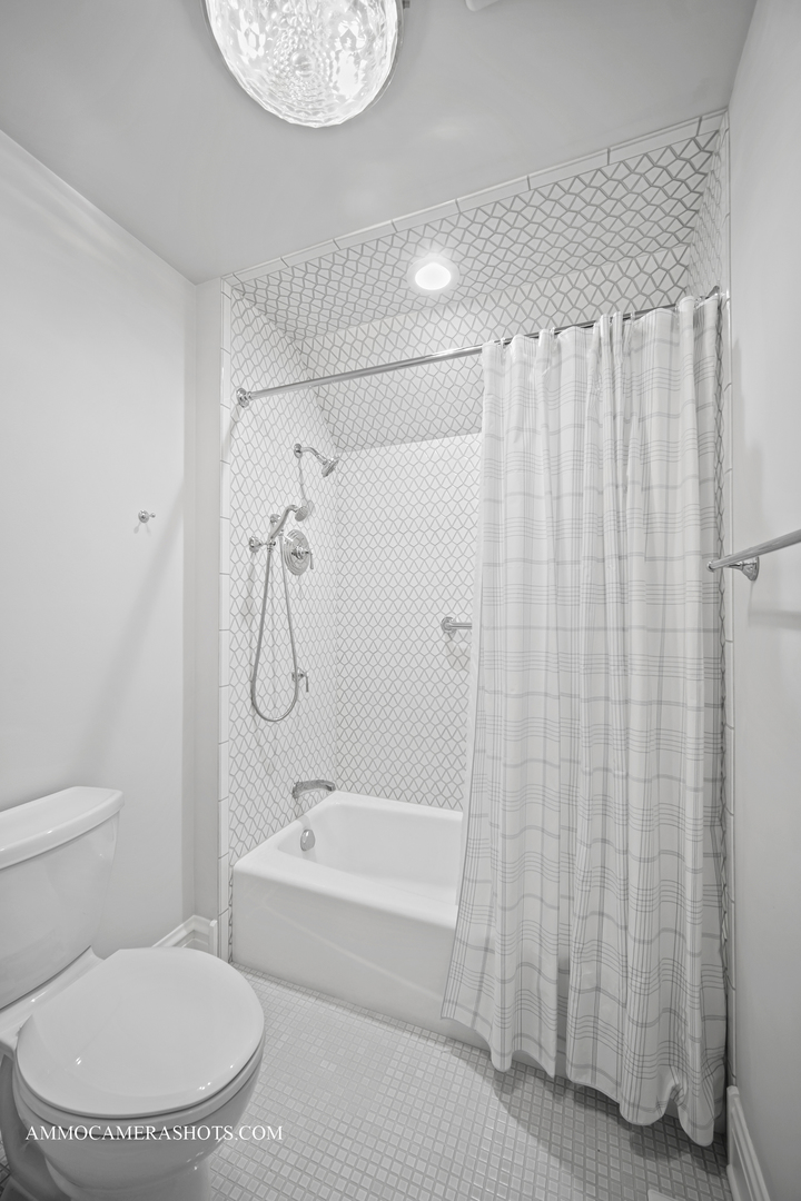 1161 Midwest Lane Wheaton, IL 60189 - Photo 19 of 45 a bathroom with a toilet and shower