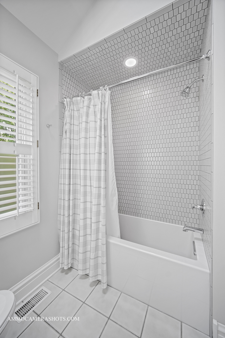 1161 Midwest Lane Wheaton, IL 60189 - Photo 22 of 45 a bathroom with a bathtub and shower