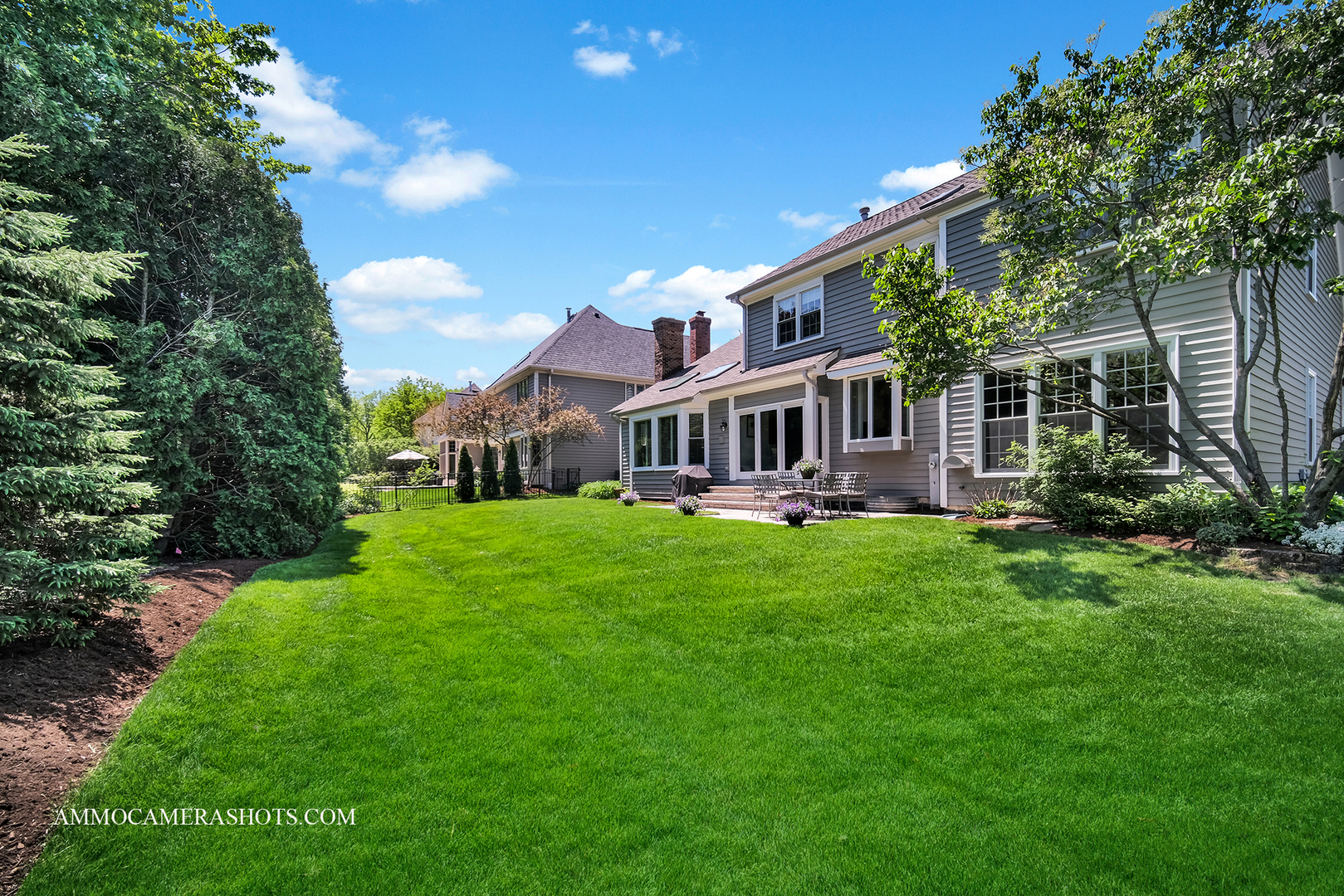 1161 Midwest Lane Wheaton, IL 60189 - Photo 43 of 45 a front view of a house with a yard table and chairs