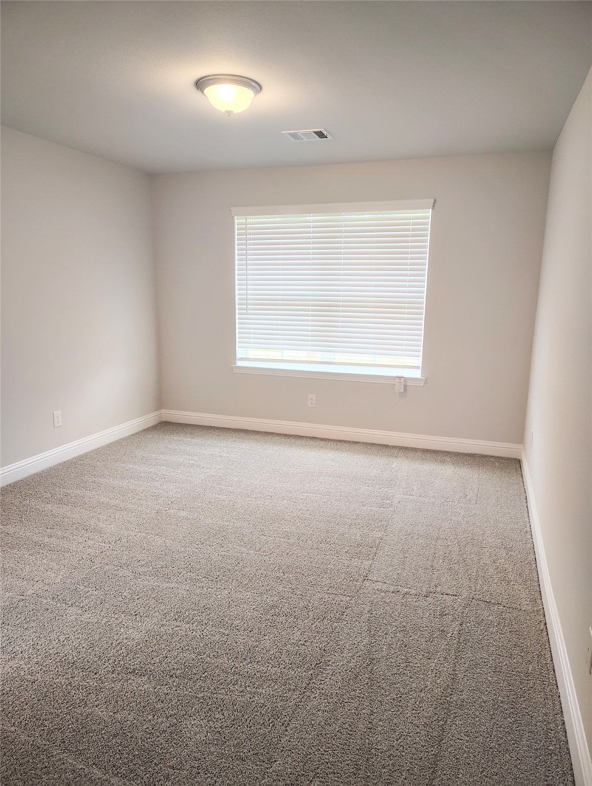 601 Greystone Lane Angleton, TX 77515 - Photo 22 of 31 an empty room with a empty space and a window