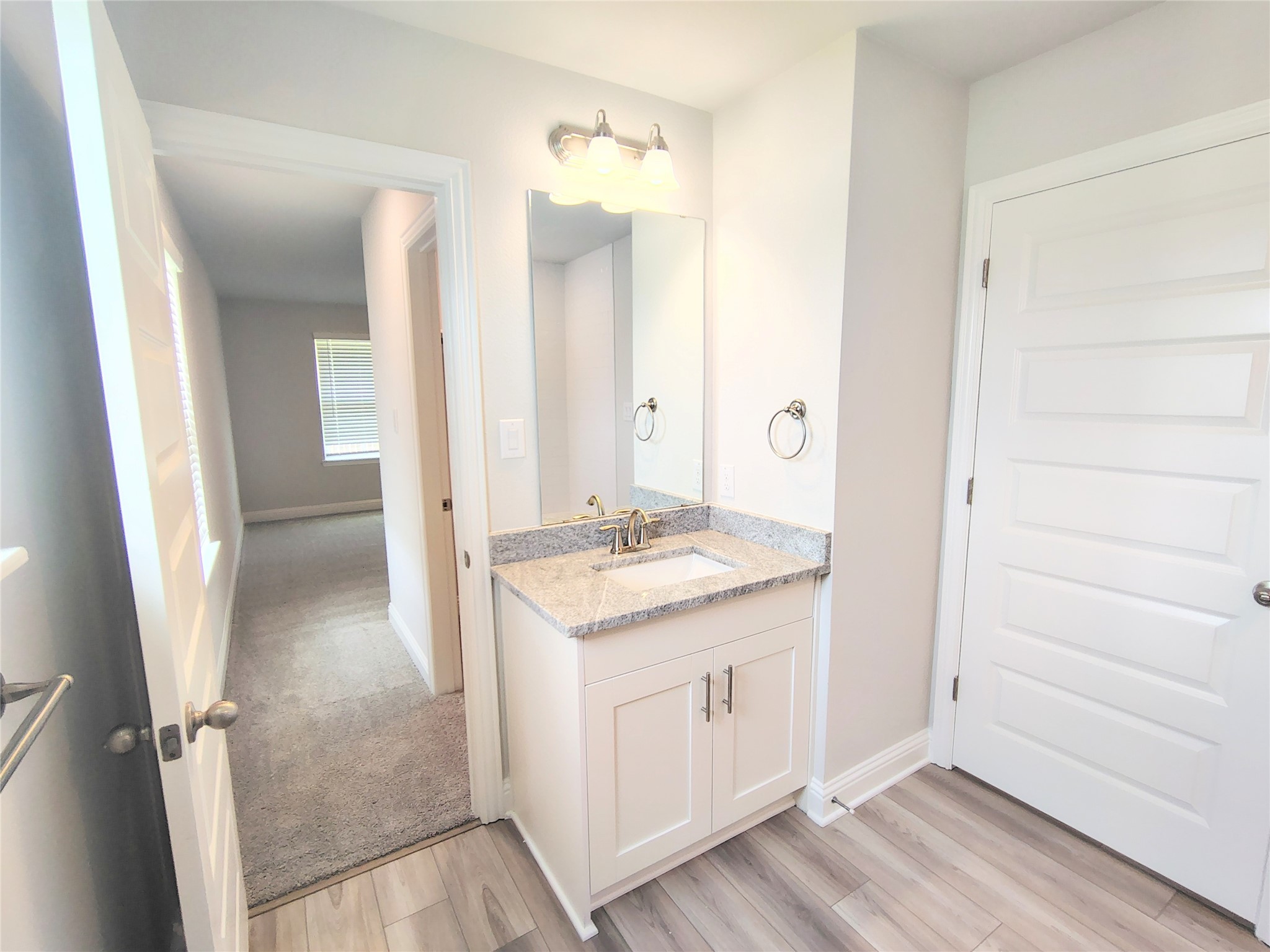 601 Greystone Lane Angleton, TX 77515 - Photo 27 of 31 view of a bathroom from a hallway