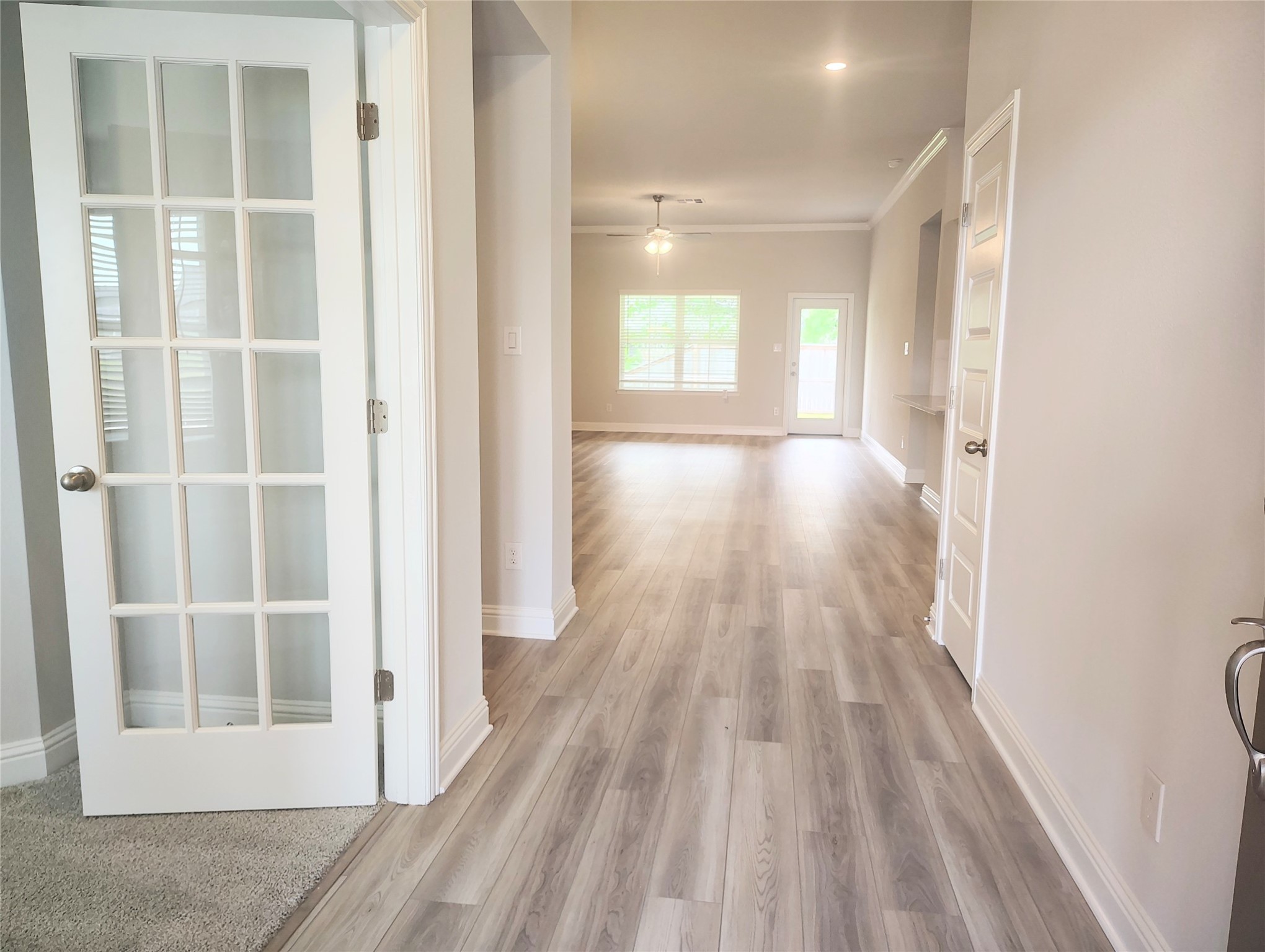 601 Greystone Lane Angleton, TX 77515 - Photo 4 of 31 a view of a room with wooden floor and windows