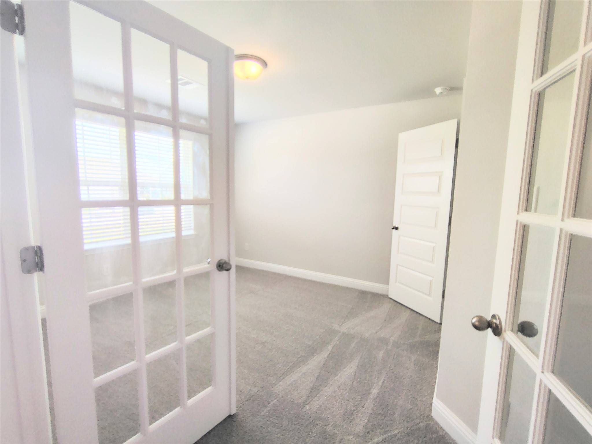 601 Greystone Lane Angleton, TX 77515 - Photo 5 of 31 a view of an empty room with a window
