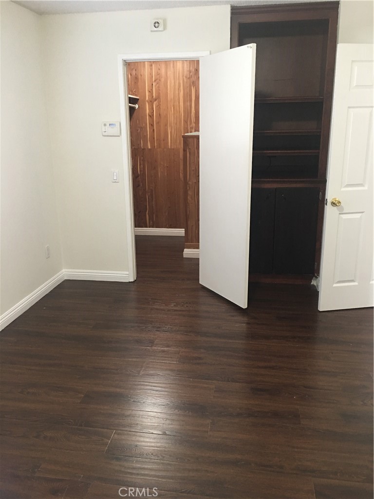 3545 20th Street Highland, CA 92346 - Photo 7 of 12 a view of a hallway with wooden floor