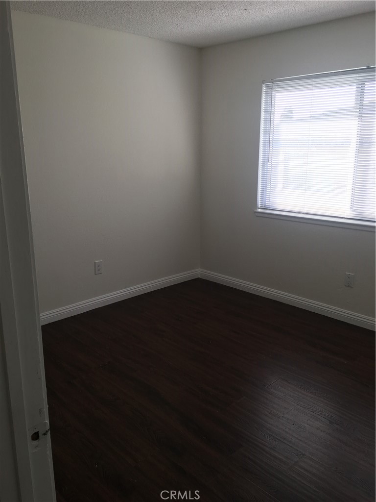 3545 20th Street Highland, CA 92346 - Photo 10 of 12 a view of a small space with wooden floor and a window