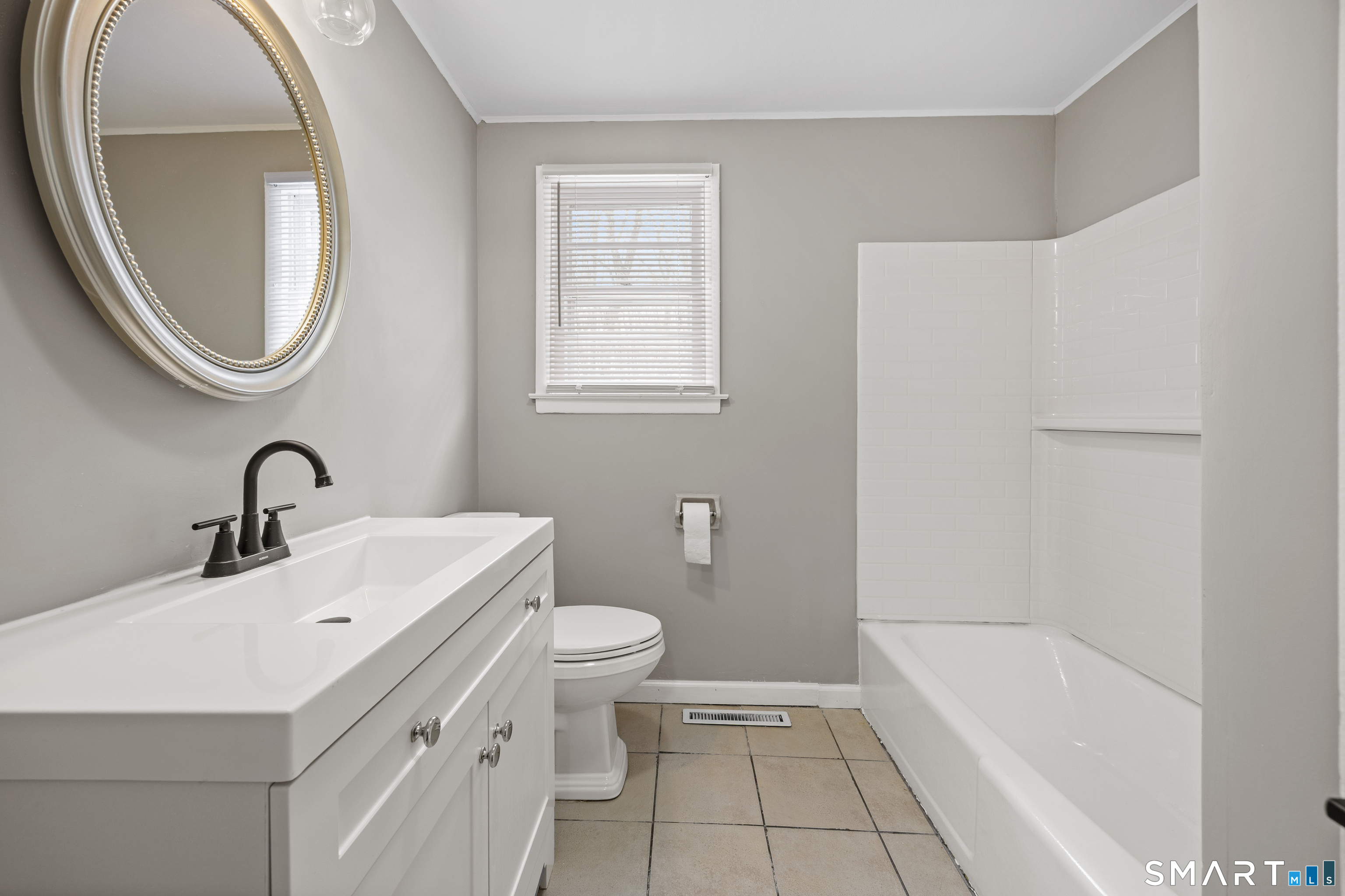 175 Devonwood Drive Waterbury, CT 06708 - Photo 13 of 30 a bathroom with a sink a toilet and a mirror