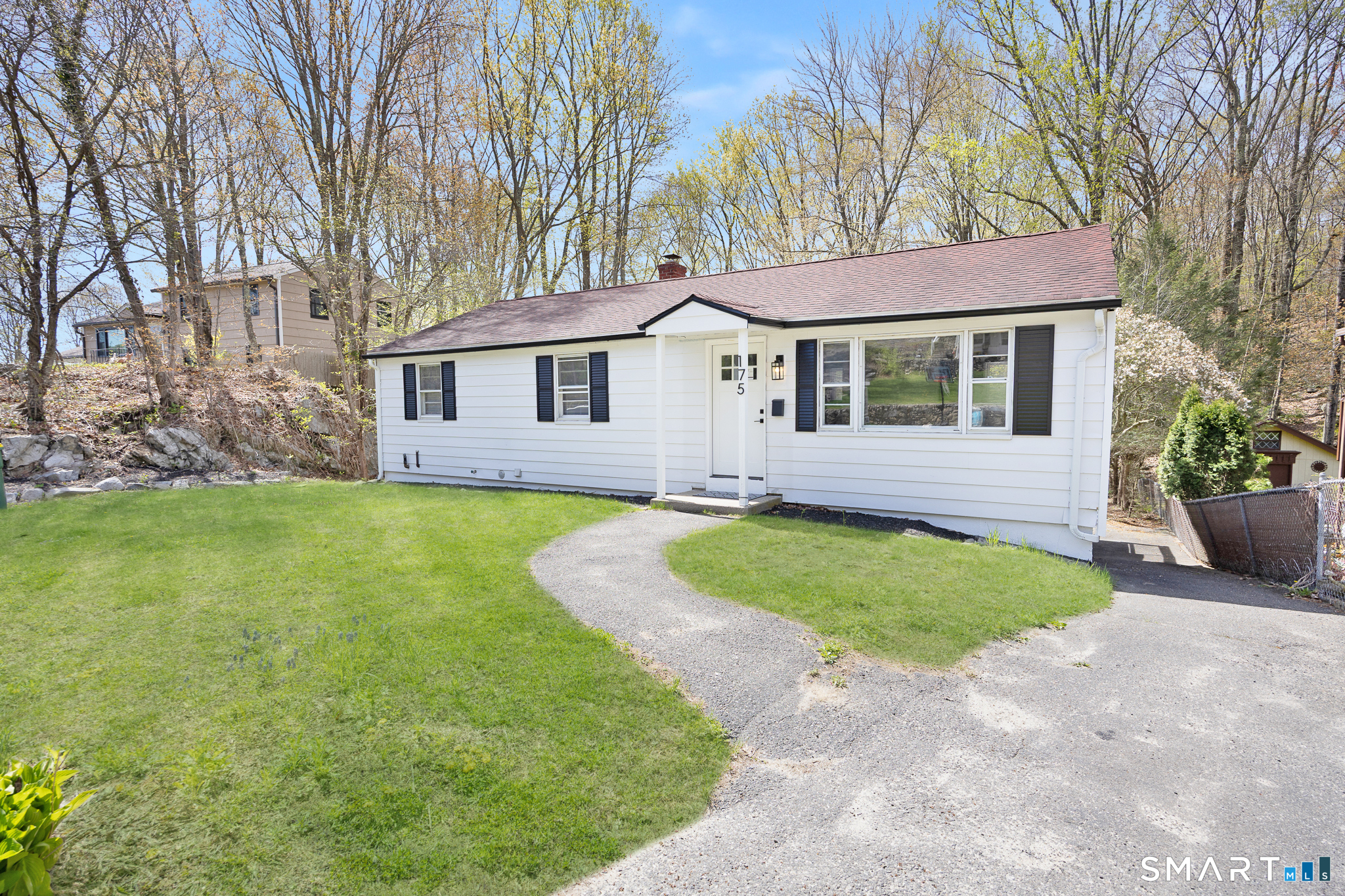 175 Devonwood Drive Waterbury, CT 06708 - Photo 2 of 30 a front view of a house with a garden