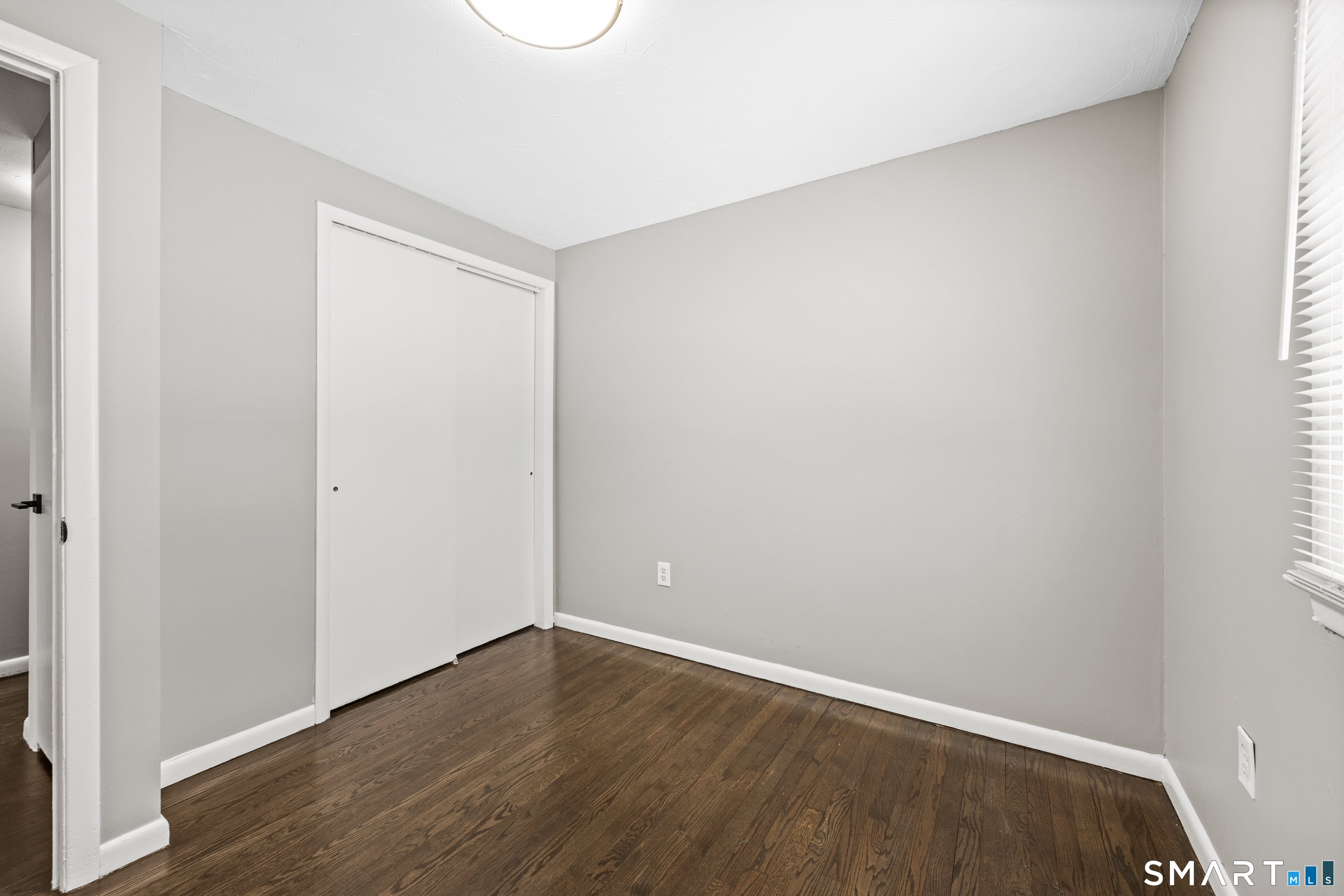 175 Devonwood Drive Waterbury, CT 06708 - Photo 21 of 30 a view of an empty room with wooden floor