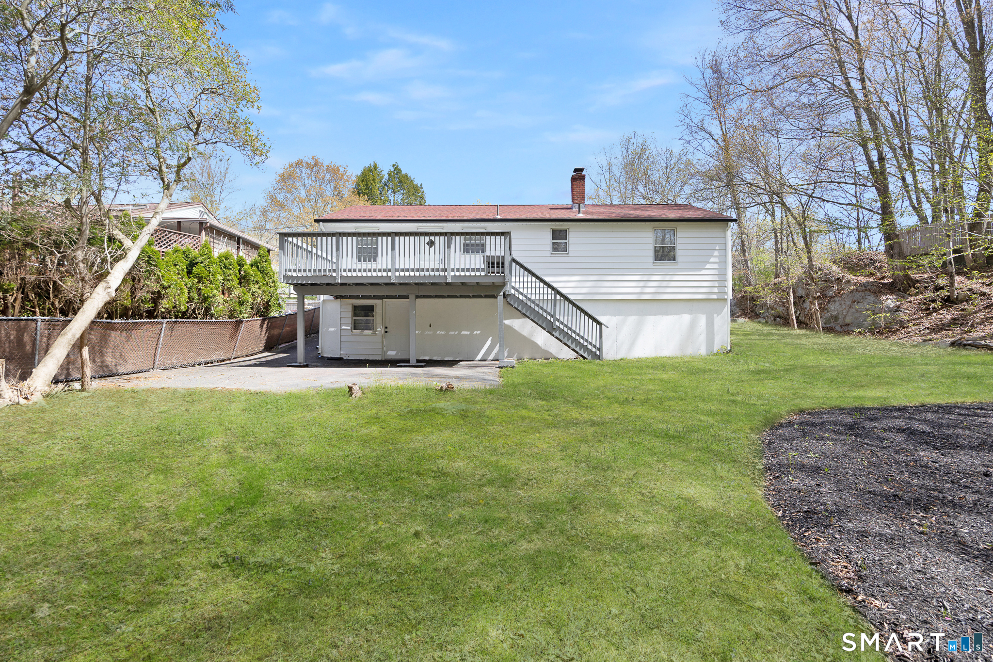 175 Devonwood Drive Waterbury, CT 06708 - Photo 27 of 30 a view of a house with a back yard