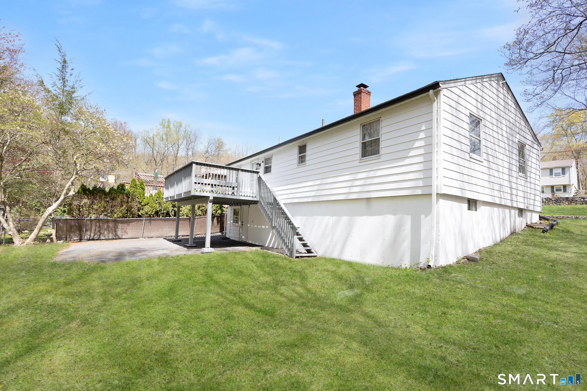 175 Devonwood Drive Waterbury, CT 06708 - Photo 28 of 30 a view of house with backyard and swimming pool