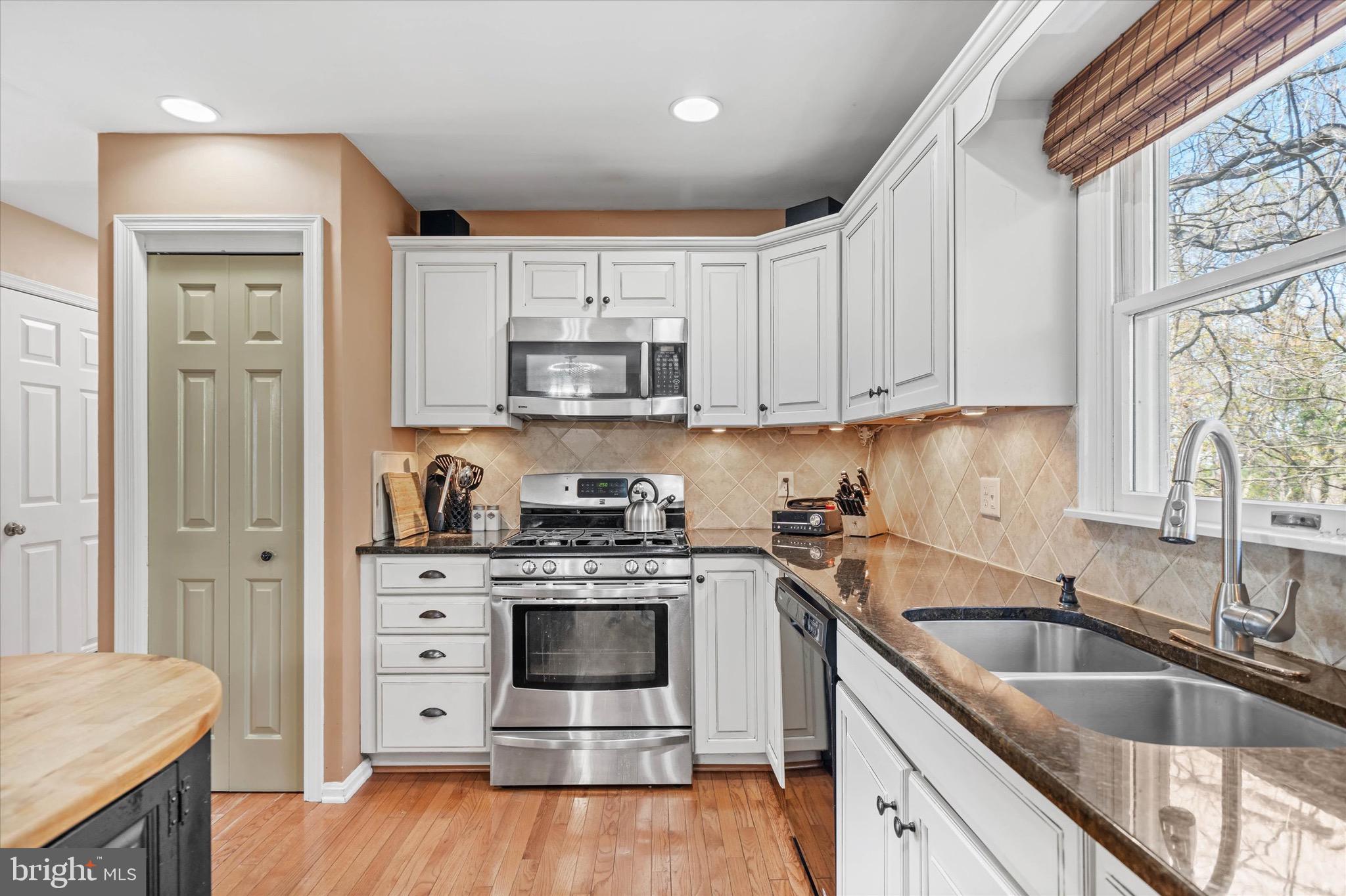 701 Christopher Drive Middletown, DE 19709 - Photo 18 of 57 a kitchen with stainless steel appliances granite countertop a sink stove and refrigerator