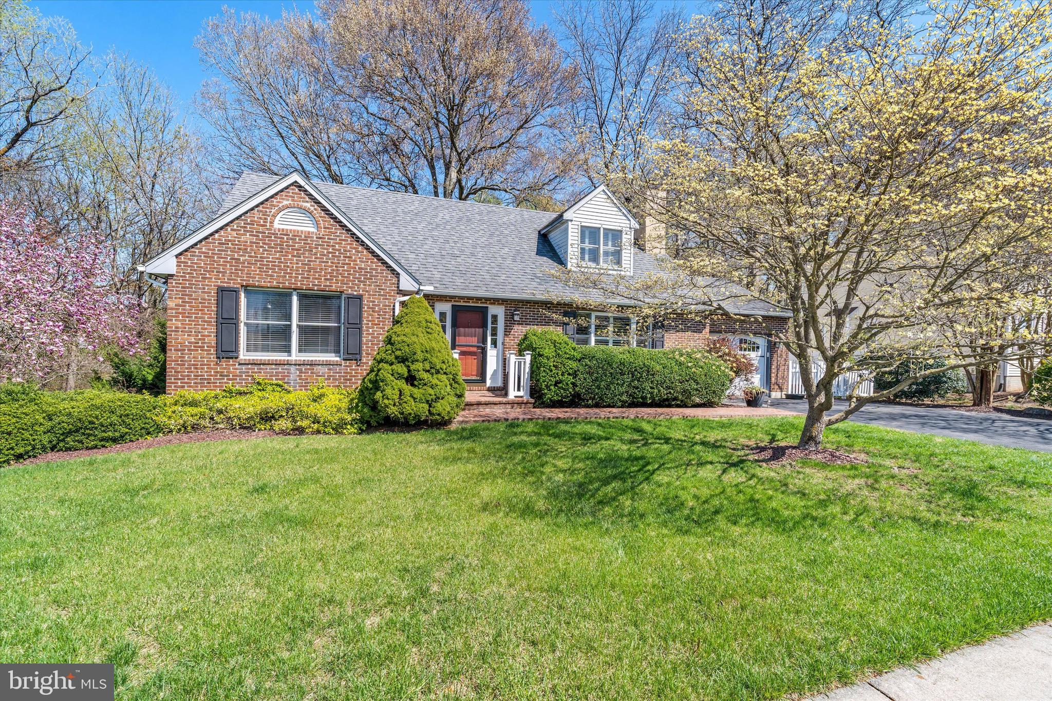 701 Christopher Drive Middletown, DE 19709 - Photo 3 of 57 a house that is sitting in the grass with tress in the background