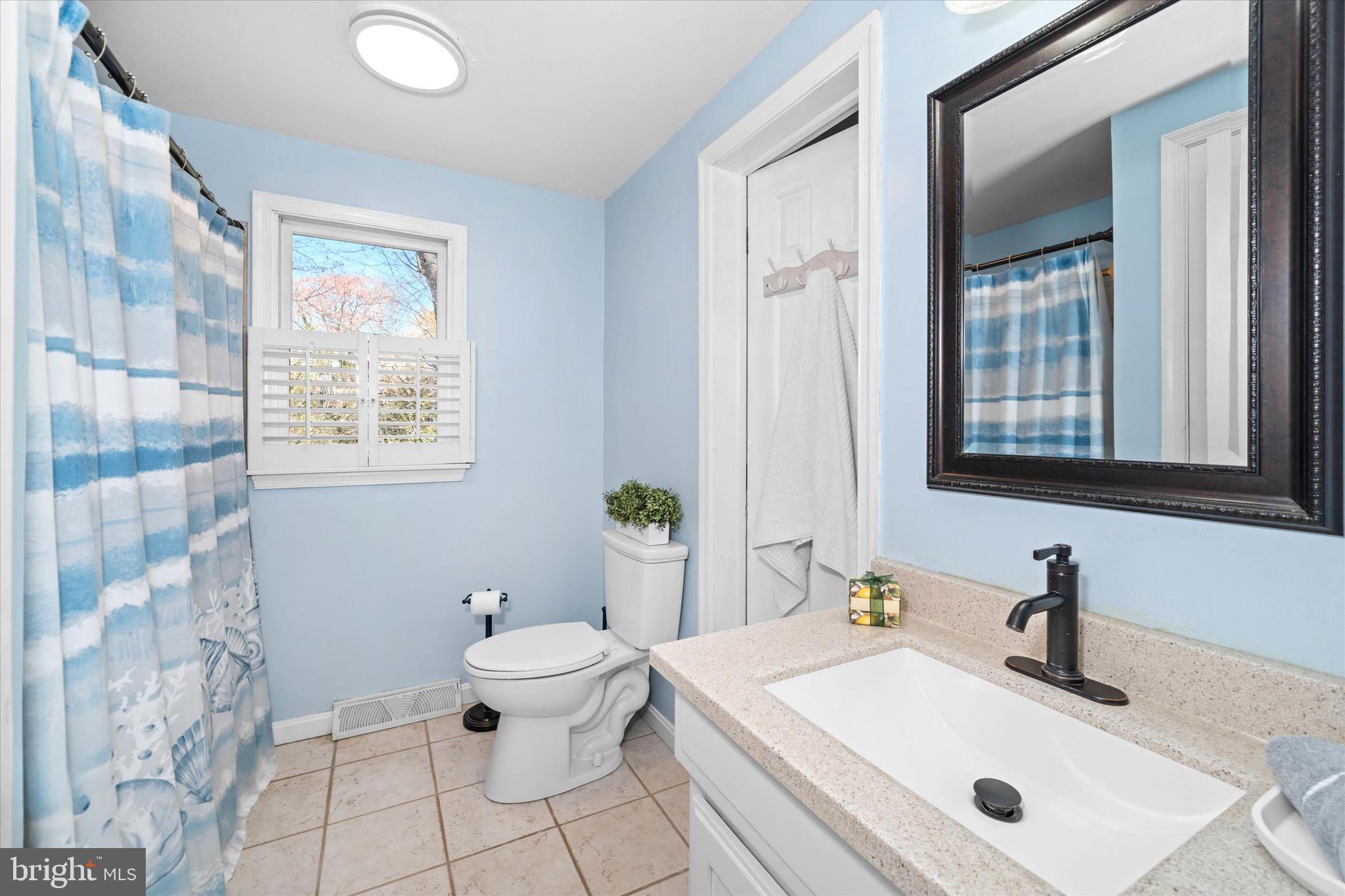 701 Christopher Drive Middletown, DE 19709 - Photo 35 of 57 a bathroom with a sink vanity mirror and toilet