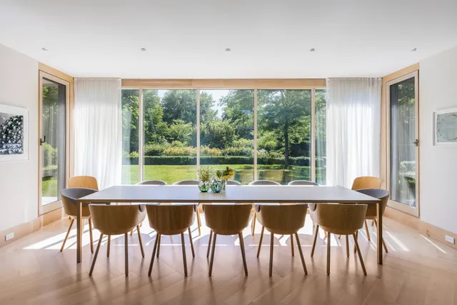 a dining room with furniture and window