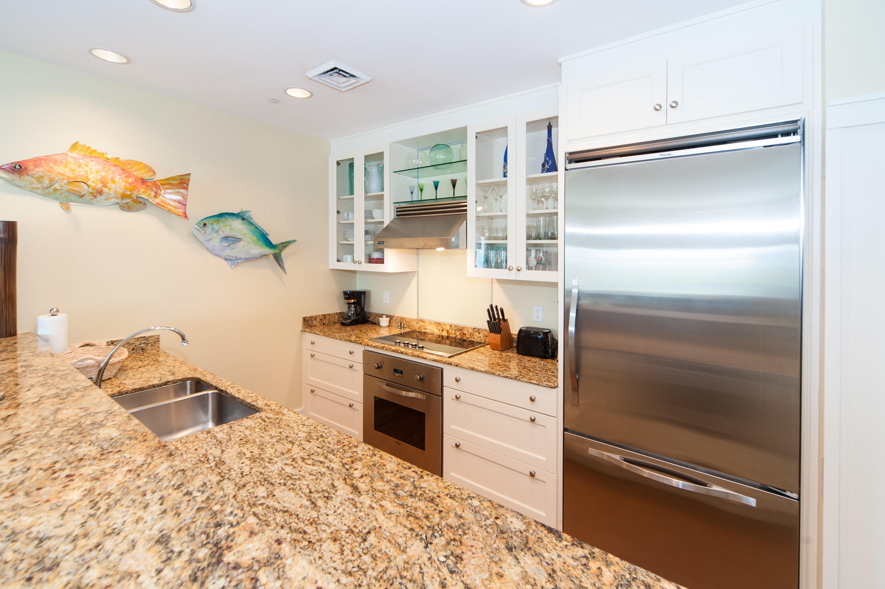 99 Compass Point Way, Unit 302 Watersound, FL 32461 - Photo 13 of 19 a kitchen with a refrigerator and a sink