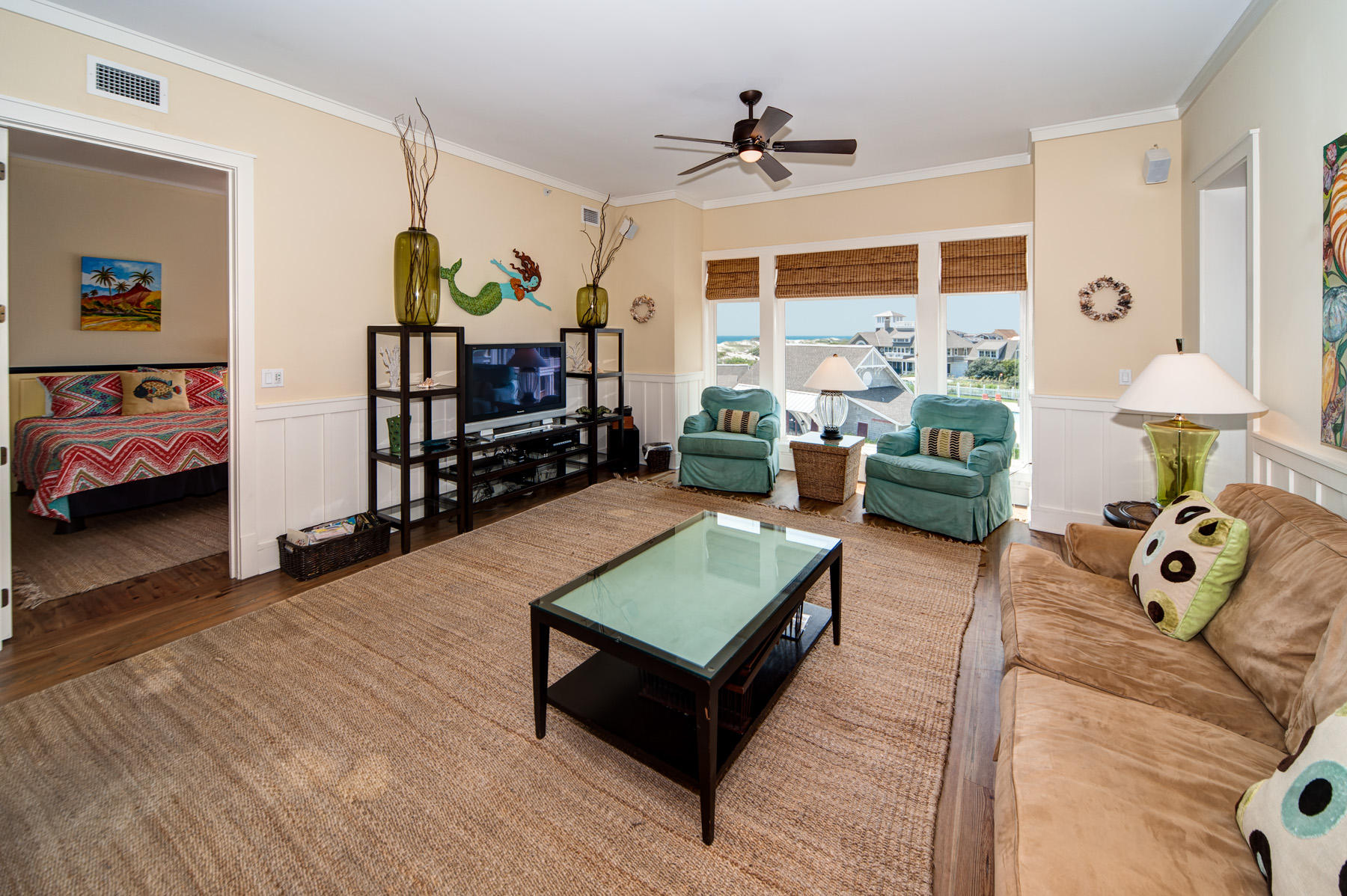 99 Compass Point Way, Unit 302 Watersound, FL 32461 - Photo 2 of 19 a living room with furniture and wooden floor