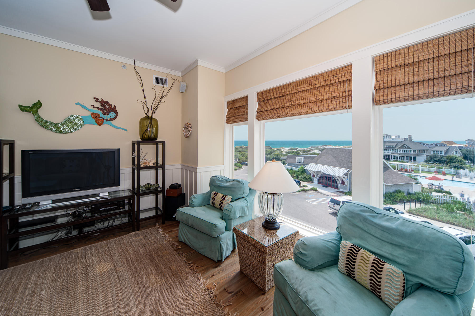 99 Compass Point Way, Unit 302 Watersound, FL 32461 - Photo 3 of 19 a living room with furniture and a flat screen tv