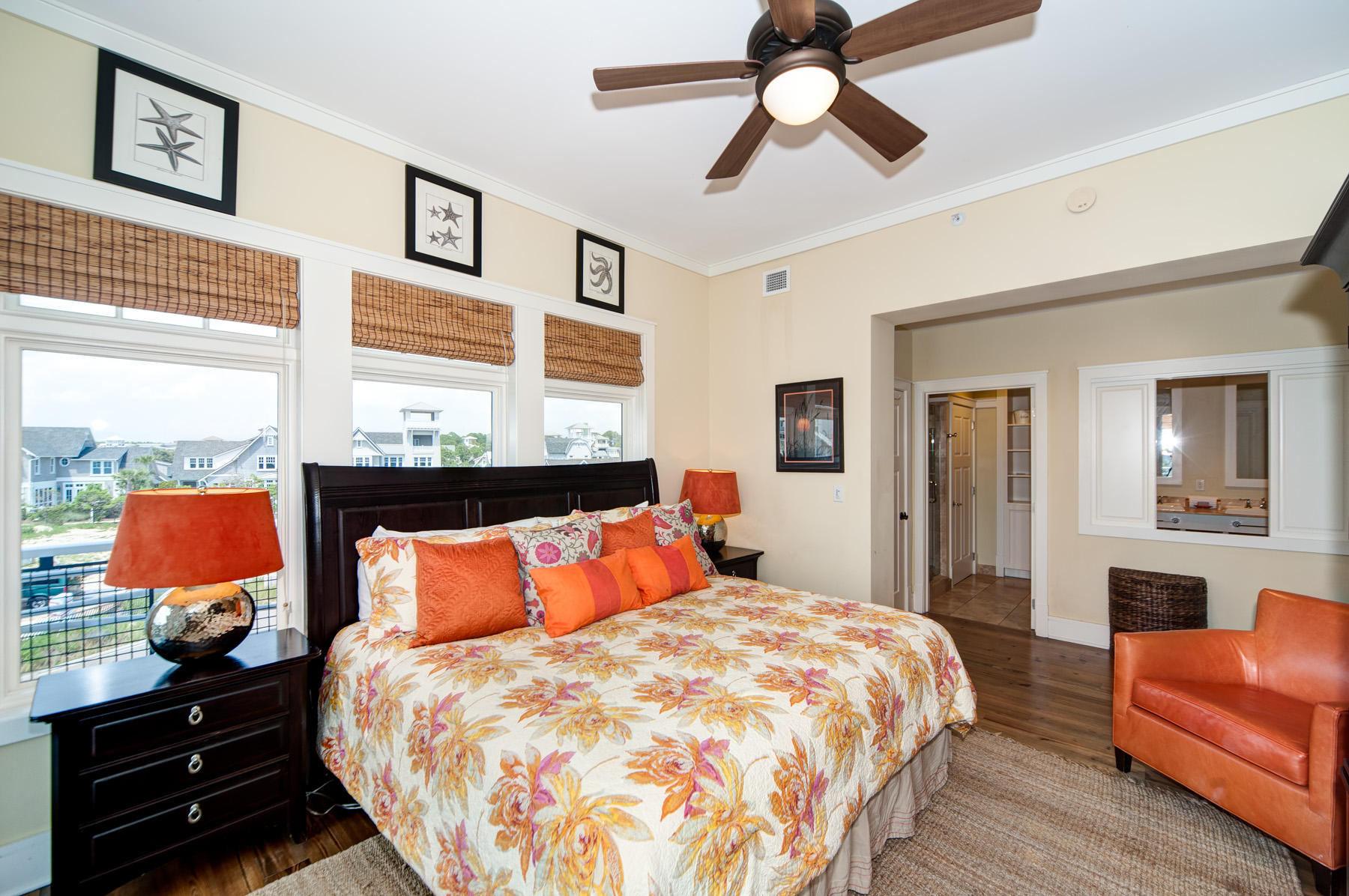 99 Compass Point Way, Unit 302 Watersound, FL 32461 - Photo 4 of 19 a bedroom with a bed and wooden floor