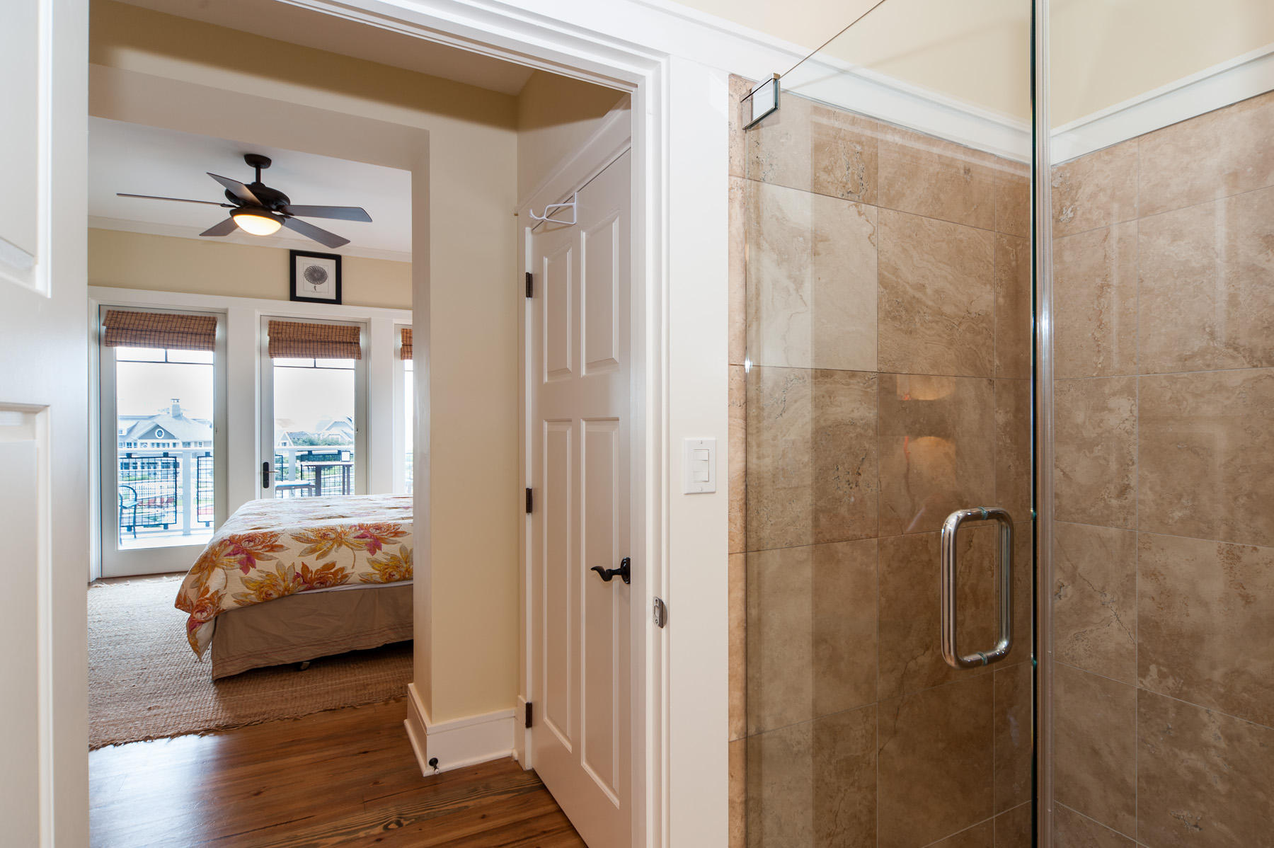99 Compass Point Way, Unit 302 Watersound, FL 32461 - Photo 8 of 19 a spacious bedroom with a balcony a bed and a window