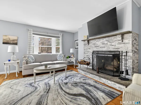 a living room with furniture and a fireplace