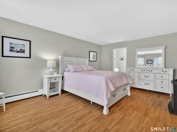 a bedroom with a bed and a view of room