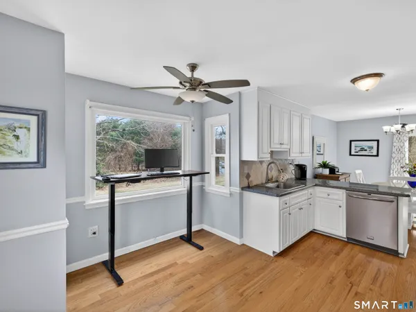 a kitchen with a stove a sink and a refrigerator