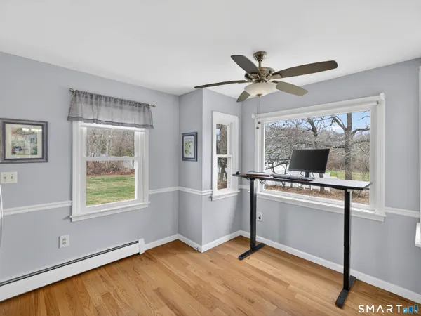 a living room with a stove and a window